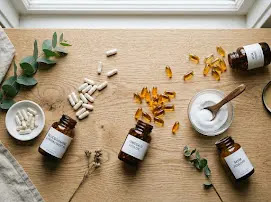 Joint health supplements and capsules arranged on a wooden table