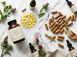 Liver recovery supplements including NAC and milk thistle capsules on a table