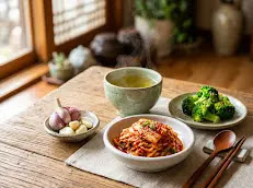 Liver-friendly Korean meal with kimchi, broccoli, and healthy side dishes