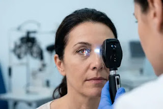 Eye exam for men over 50 — ophthalmologist checking eyes with slit lamp